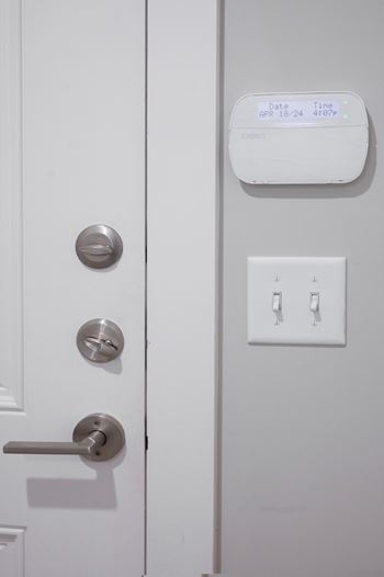 a door with a sensor on it and a door handle